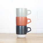 Three Kinto Stacking Mugs in Orange Black and Grey 